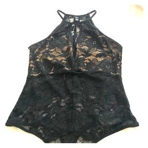 A black bodysuit top.